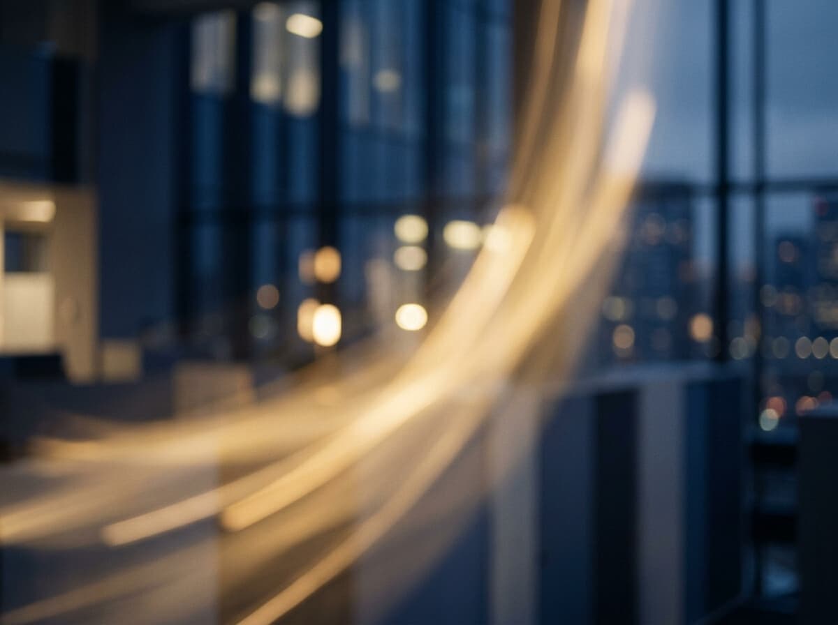 An abstract warm gold rising line evoking momentum and a softly glowing data dashboard.